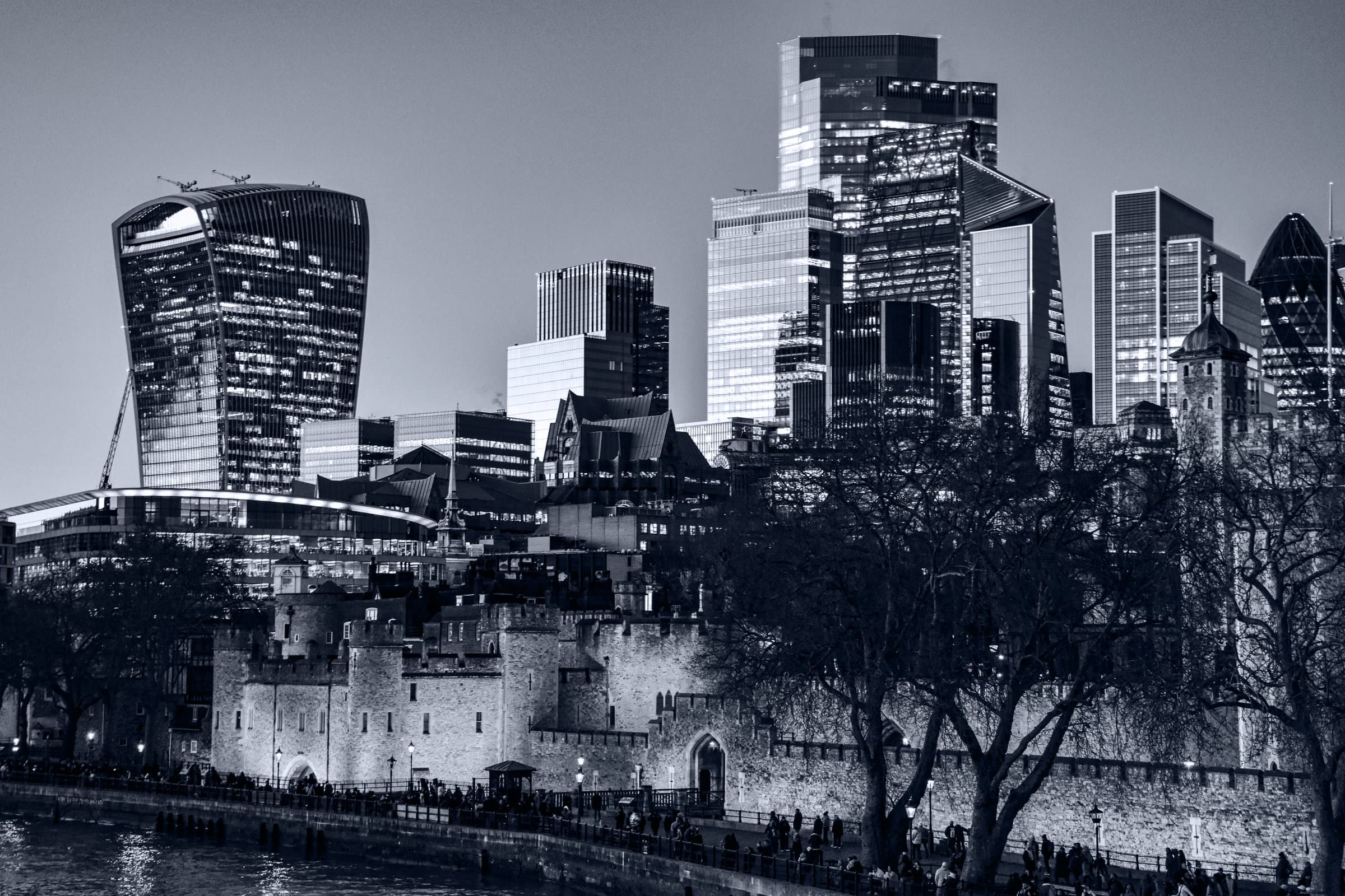 The Tower of London and the City of London skyline at dusk